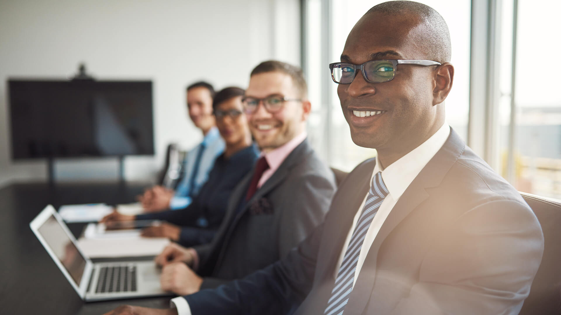 Businessmen in a meeting looking confident