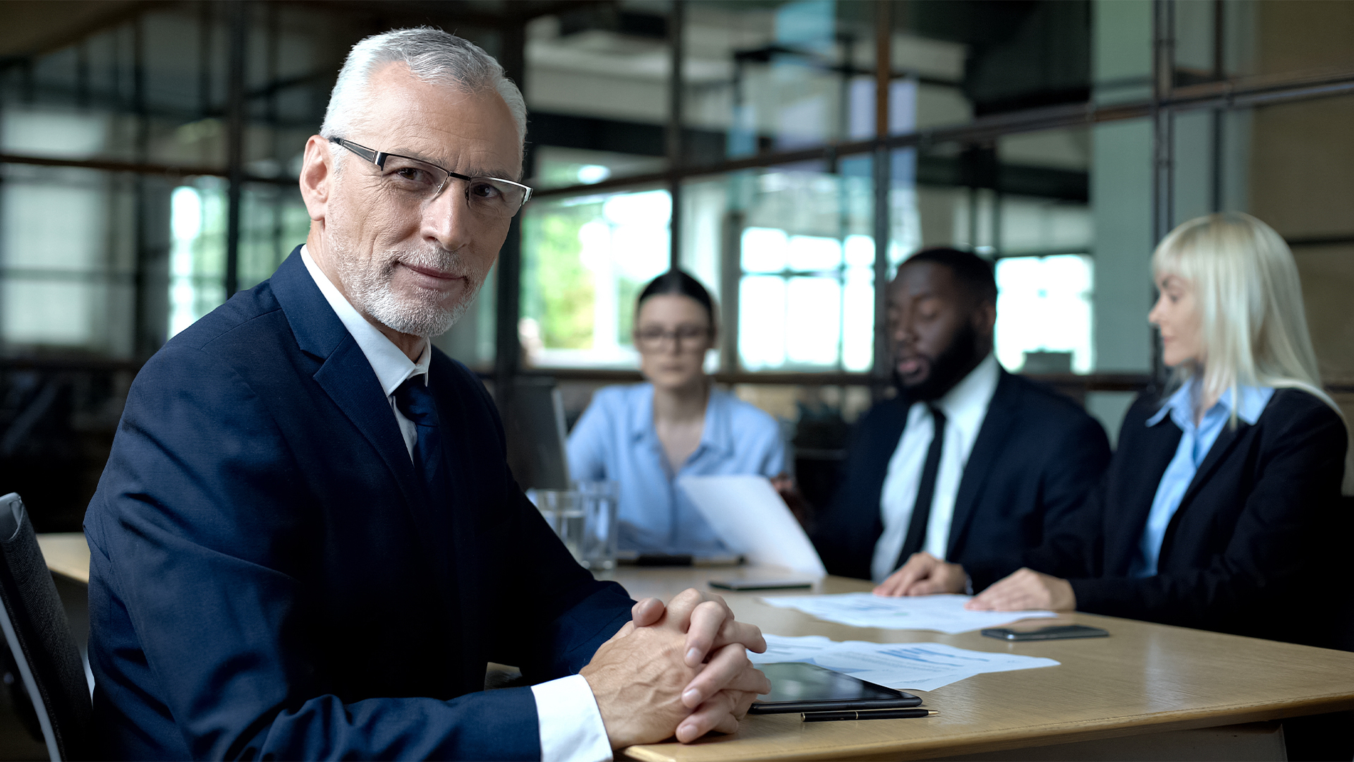 Elderly company director looking camera