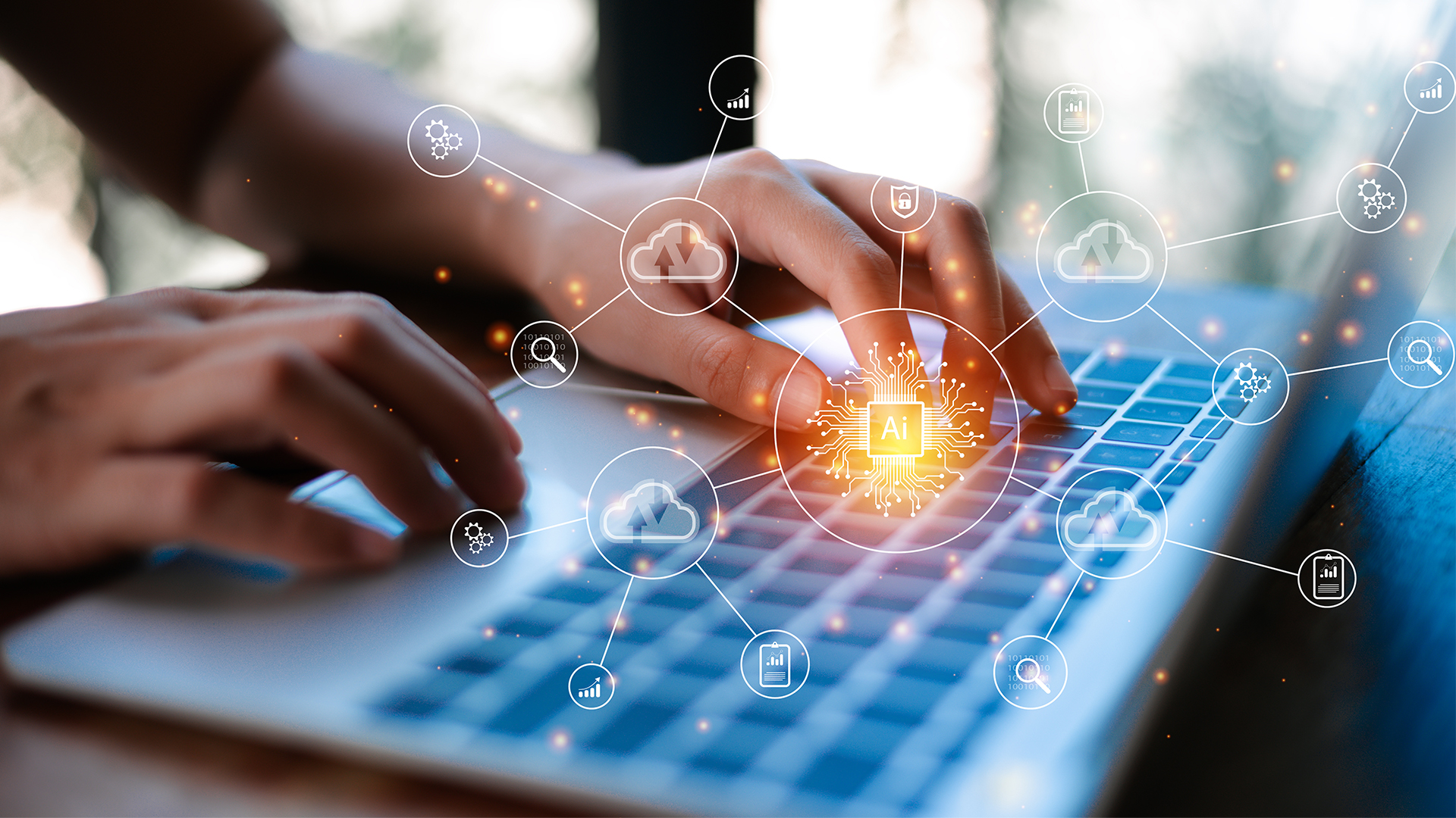 hands typing on laptop keyboard